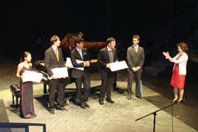 student and faculty receive awards on stage