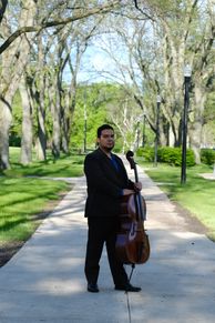 Gerardo Sanchez Pastrana holding a cello