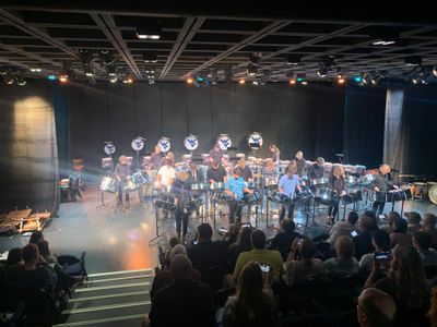Percussion academy students performing on stage in front of an audience